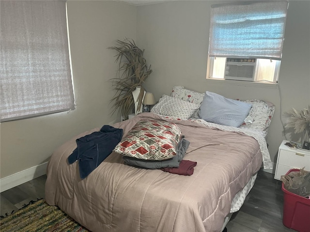 1874 Douglas Ave, Clearwater, FL 33755 - bedroom with baseboards, wood finished floors, and cooling unit