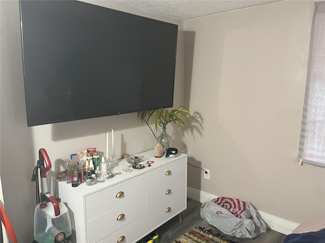 1874 Douglas Ave, Clearwater, FL 33755 - bedroom featuring baseboards and a textured ceiling