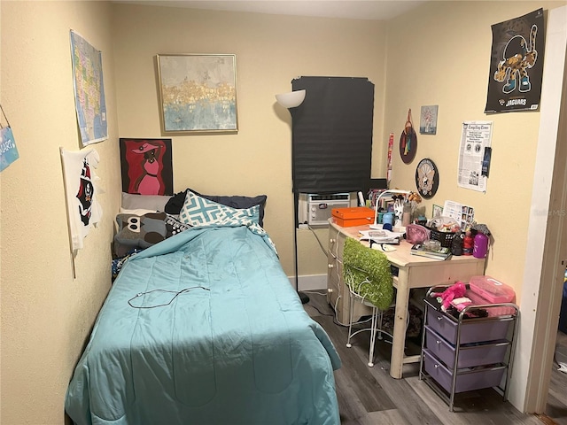 bedroom featuring dark hardwood / wood-style floors