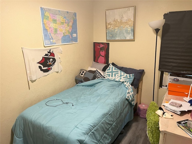 bedroom featuring dark hardwood / wood-style floors