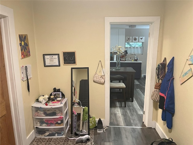 hallway with dark hardwood / wood-style floors