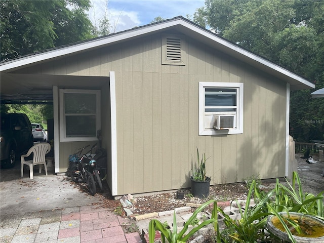 view of home's exterior with a carport