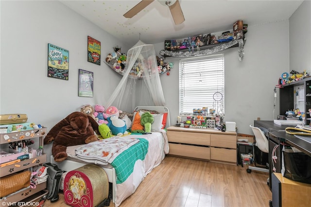 bedroom featuring light wood-type flooring and ceiling fan