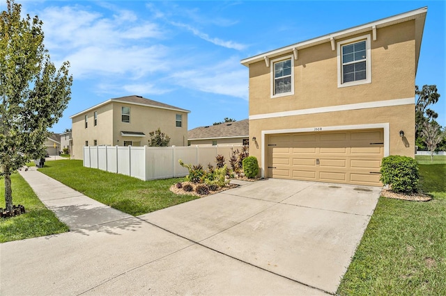 front of property featuring a garage and a front lawn