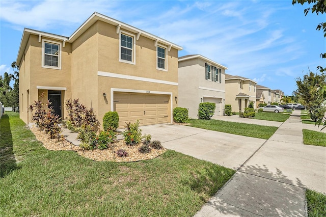 view of front of property with a garage and a front yard