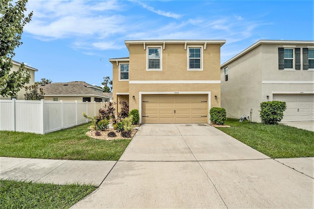 front facade featuring a garage and a front yard