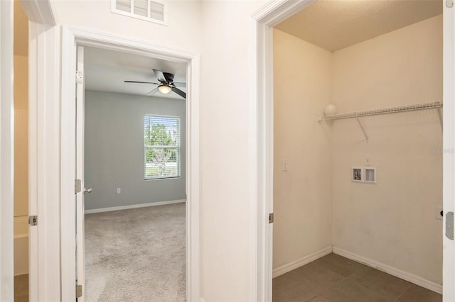 laundry area featuring hookup for a washing machine, ceiling fan, and light carpet