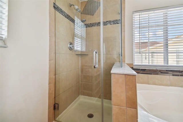 bathroom with separate shower and tub