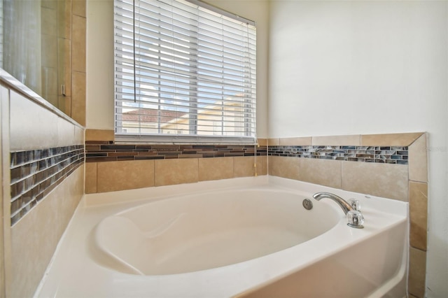 bathroom with a tub to relax in