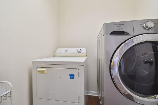 washroom featuring washing machine and clothes dryer