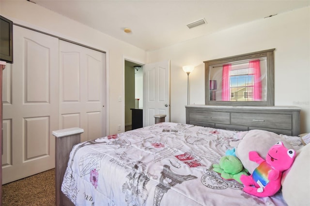 carpeted bedroom with a closet