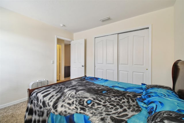 bedroom with a closet and carpet floors