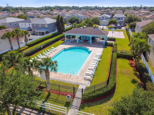 view of pool with a lawn and a patio area