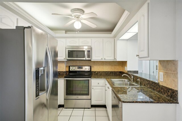 kitchen featuring stainless steel appliances, sink, ceiling fan, and white cabinetry