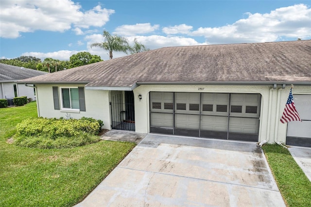 ranch-style home featuring a front lawn and central AC unit