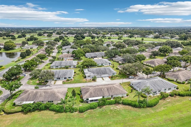 bird's eye view featuring a residential view and a water view