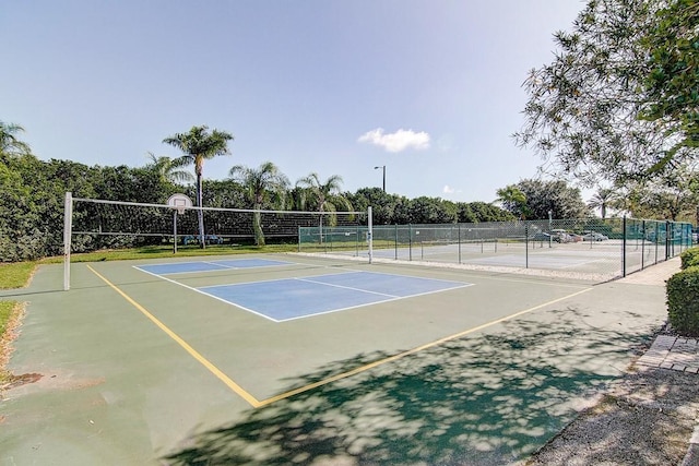 view of tennis court with fence