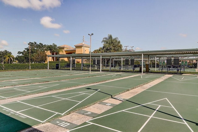 view of property's community featuring shuffleboard