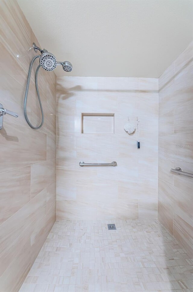 7037 Sunset Dr S Unit 602, South Pasadena, FL 33707 - bathroom featuring a tile shower