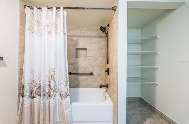 bathroom with tile patterned flooring and shower / bath combo with shower curtain