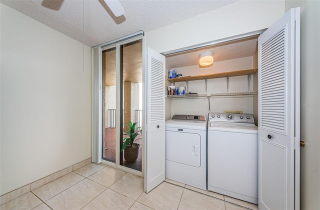 laundry area featuring ceiling fan, a textured ceiling, washing machine and clothes dryer, and light tile patterned flooring