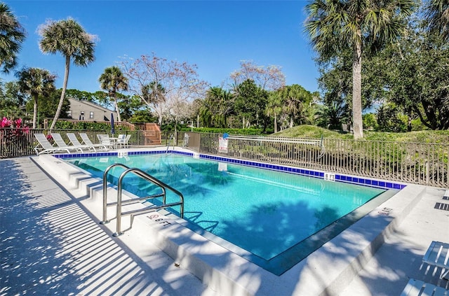 7037 Sunset Dr S Unit 602, South Pasadena, FL 33707 - community pool featuring a patio area and fence