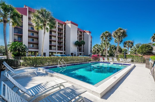 7037 Sunset Dr S Unit 602, South Pasadena, FL 33707 - pool with a patio area and fence