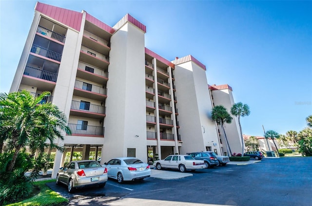 7037 Sunset Dr S Unit 602, South Pasadena, FL 33707 - view of building exterior featuring uncovered parking