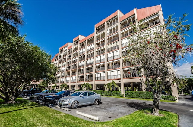 7037 Sunset Dr S Unit 602, South Pasadena, FL 33707 - view of building exterior with uncovered parking