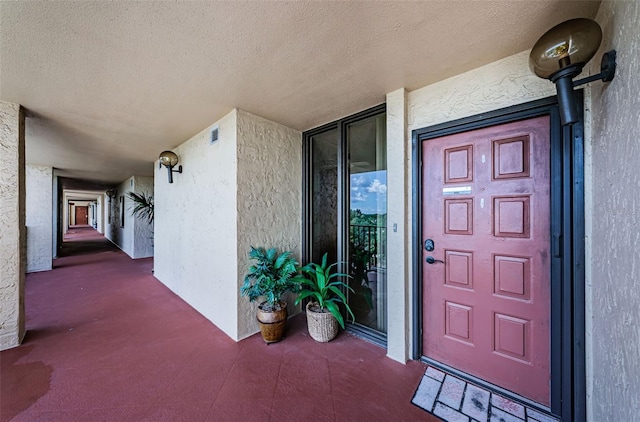 7037 Sunset Dr S Unit 602, South Pasadena, FL 33707 - doorway to property with stucco siding