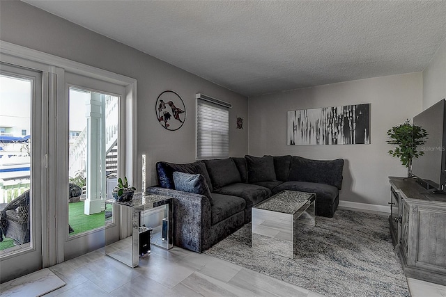 living room featuring a textured ceiling