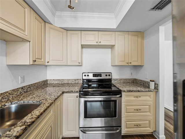 kitchen featuring stainless steel range with electric stovetop, crown molding, dark hardwood / wood-style floors, light stone countertops, and cream cabinetry