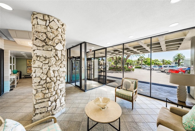 7100 Sunset Way Unit 405, St Pete Beach, FL 33706 - building lobby featuring recessed lighting and a textured ceiling