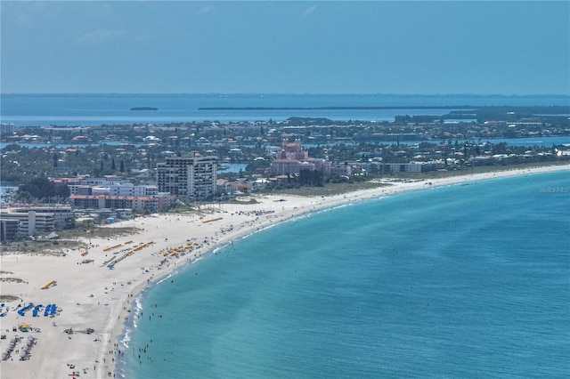 bird's eye view featuring a view of the beach and a water view