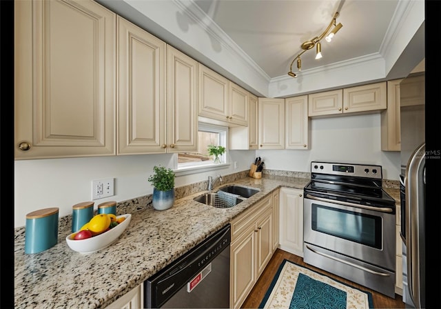 7100 Sunset Way Unit 405, St Pete Beach, FL 33706 - kitchen with stainless steel appliances, a sink, cream cabinetry, crown molding, and light stone counters