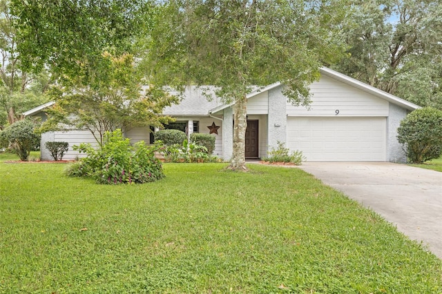 single story home with a garage and a front lawn