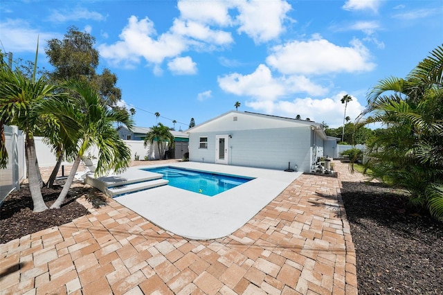 view of swimming pool featuring a patio area