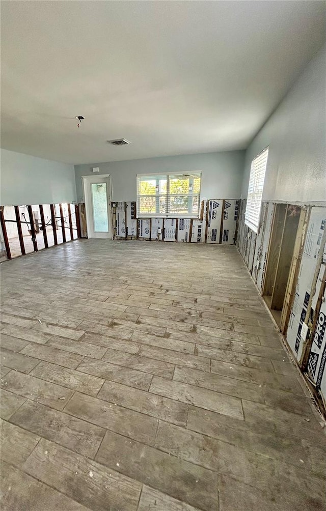 spare room with light hardwood / wood-style flooring