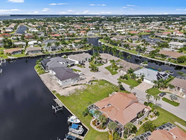 aerial view with a water view and a residential view