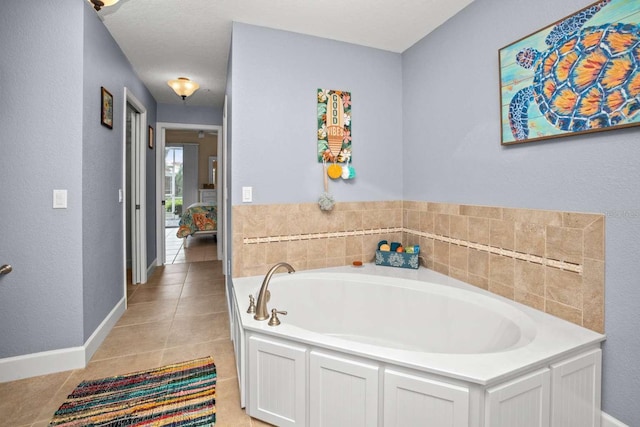 bathroom featuring a bath and tile patterned flooring