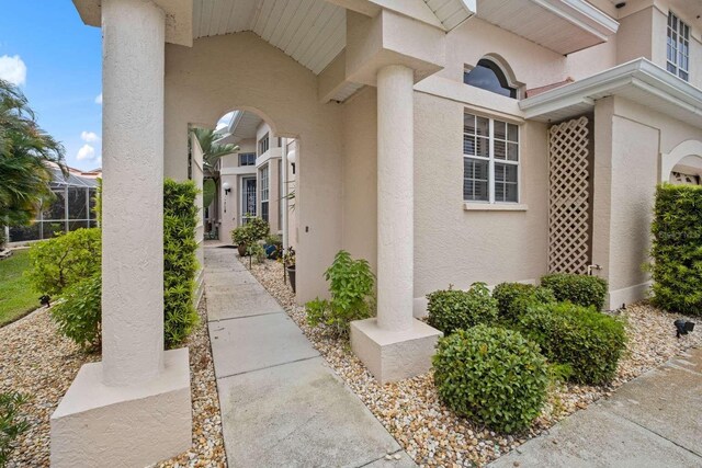 property entrance with stucco siding