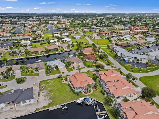 birds eye view of property featuring a residential view and a water view