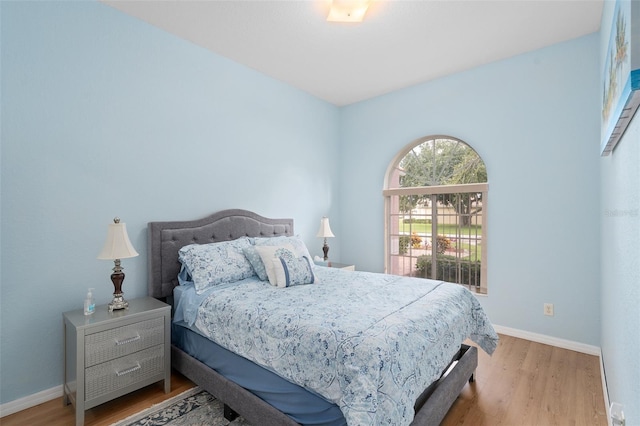 bedroom with light hardwood / wood-style flooring