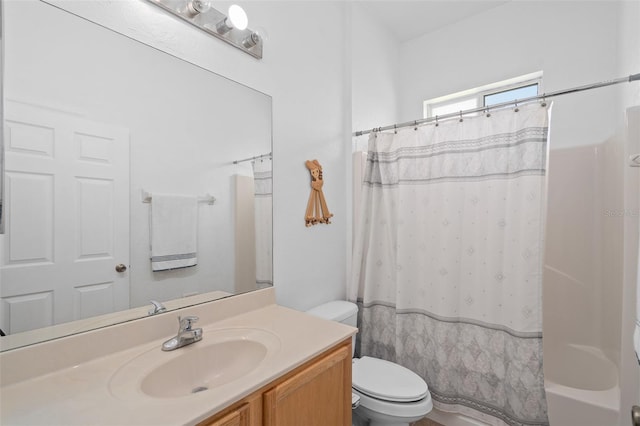 bathroom with toilet and vanity