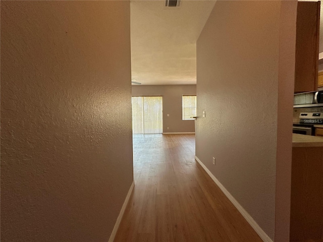 corridor featuring hardwood / wood-style floors