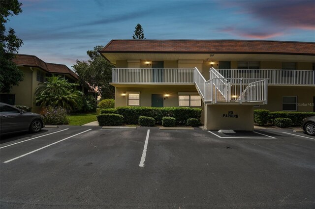 view of property featuring uncovered parking
