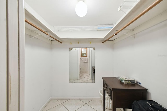 spacious closet featuring light tile patterned floors