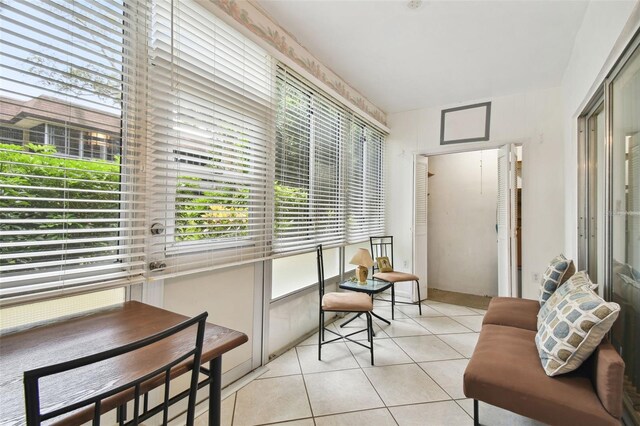 sunroom / solarium featuring tile patterned flooring