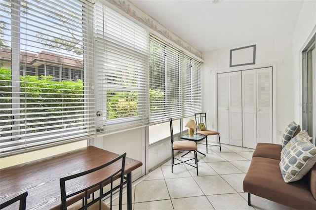 living room featuring light tile patterned floors and a wealth of natural light