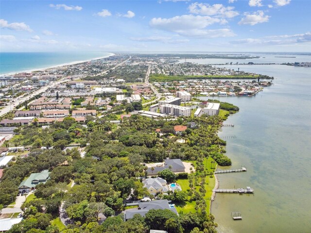 aerial view of property and surrounding area featuring a large body of water